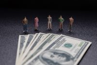Miniature people: Group of small businessmen standing on coin with  Business Growth concept. | Freepik