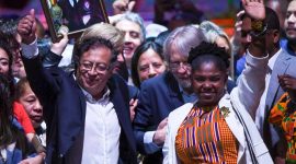 Newly elected Colombian President Gustavo Petro (L) and his running mate Francia Marquez  celebrate at the Movistar Arena in Bogota, on June 19, 2022 after winning the presidential runoff election on June 19, 2022.  Ex-guerrilla Gustavo Petro was on Sunday elected the first ever left-wing president of crisis-wracked Colombia after beating millionaire businessman rival Rodolfo Hernandez after a tense and unpredictable election. (Photo by Juan BARRETO / AFP)