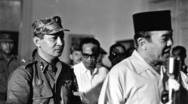 INDONESIA - MARCH 11:  President Sukarno (R) of Indonesia walks with the Major General Suharto (L) March 11, 1966 in Idonesia. Sukarno, was obliged (ordered) by the Indonesia Army to give Major General Suharto Supreme Authority to restore order after the Sept. 30, 1965 murders of six Generals, Army Chief Nation's bodyguard and daughter, accused by the army of being led by the Indonesia Communist Party, (the PKI). General Suharto, not of high enough rank to be on the hit list, took over leadership of the army. Between October 1965 and March 1966, under Suharto's command, thousands of suspected and known communists were killed and imprisoned throughout Indonesia.   In March 1976, the Indonesian Parliament (The People's General Assembly) stripped President Sukarno of all powers and appointed General Suharto as Acting President.  Sukarno was placed under house arrest until his death in June, 1970.  (Photo by Beryl Bernay/Getty Images)